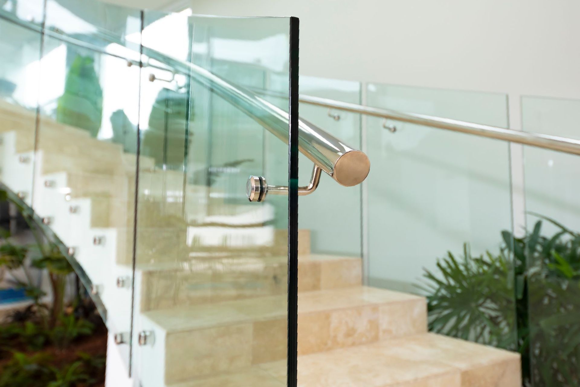 Close-Up Of Glass Fence And Metal Railing Attached To Staircase — Star Glass Design Pty Ltd in Mayfield, NSW