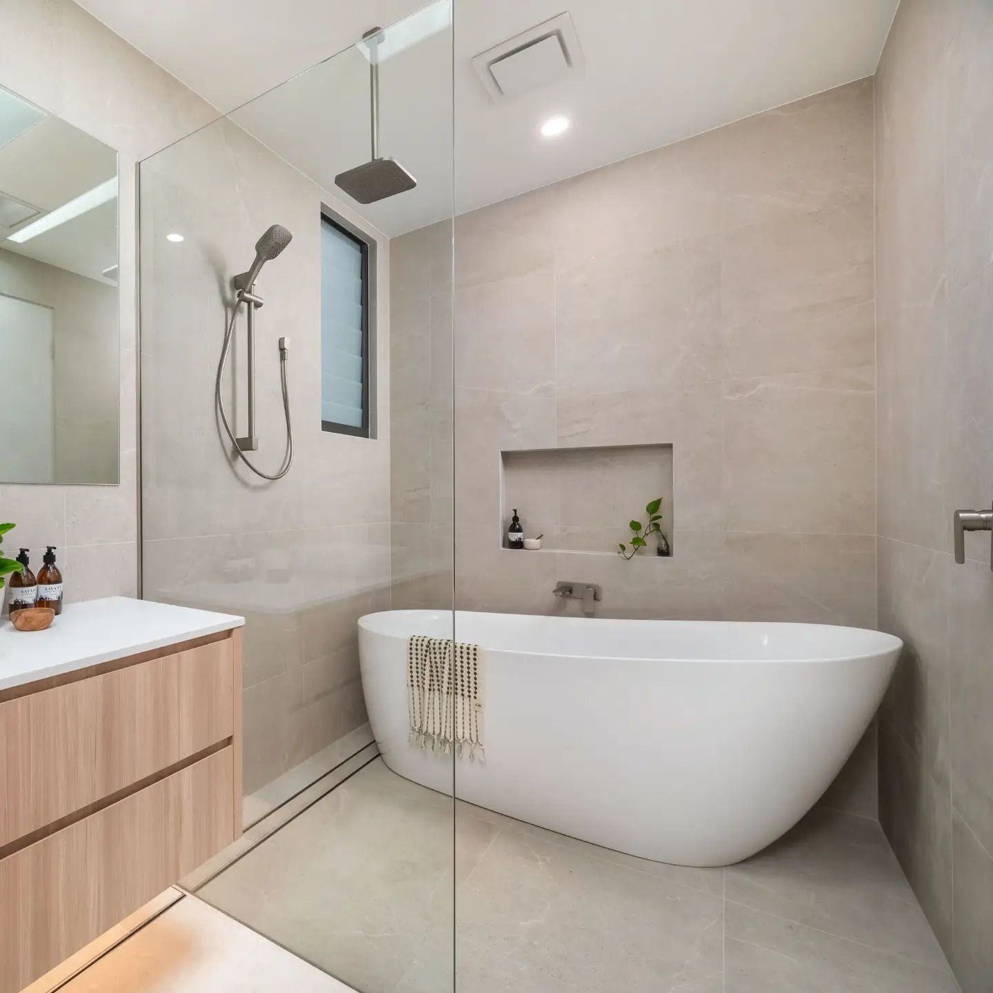 Bathtub and Shower Area in Bathroom with Detachable Shower Head — Star Glass Design Pty Ltd in Mayfield, NSW