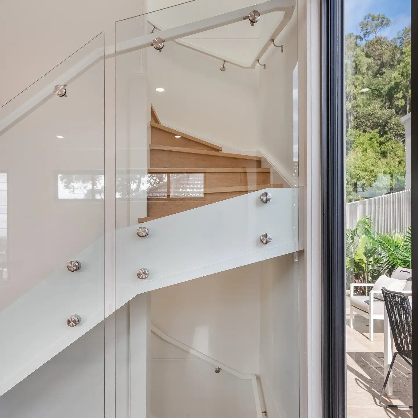 Timber Staircase With Glass Panels Leading Up And Around A Corner — Star Glass Design Pty Ltd in Mayfield, NSW
