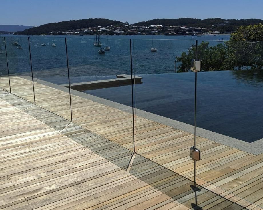 A Wooden Deck Overlooking a Large Body of Water — Star Glass Design Pty Ltd in Mayfield, NSW