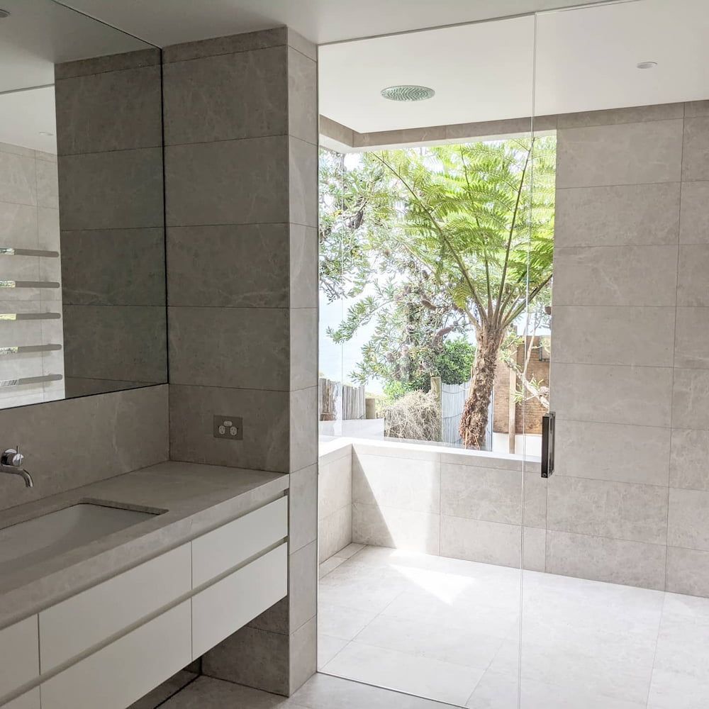 A Bathroom With A Sink And A Large Window — Star Glass Design Pty Ltd in Mayfield, NSW