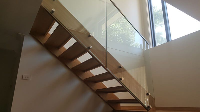 A Staircase With A Glass Railing Leading To A Dining Room  — Star Glass Design Pty Ltd in Mayfield, NSW