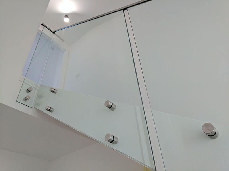 A Close Up Of A Glass Railing On A Staircase  — Star Glass Design Pty Ltd in Mayfield, NSW