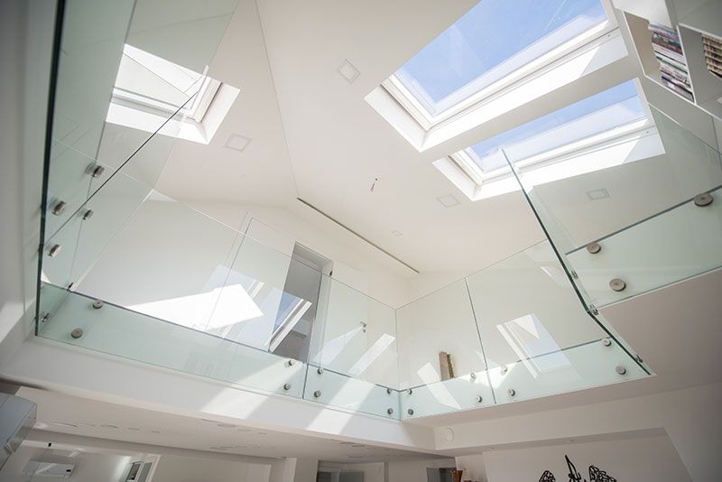 A Staircase With A Glass Railing And Skylights On The Ceiling  — Star Glass Design Pty Ltd in Mayfield, NSW