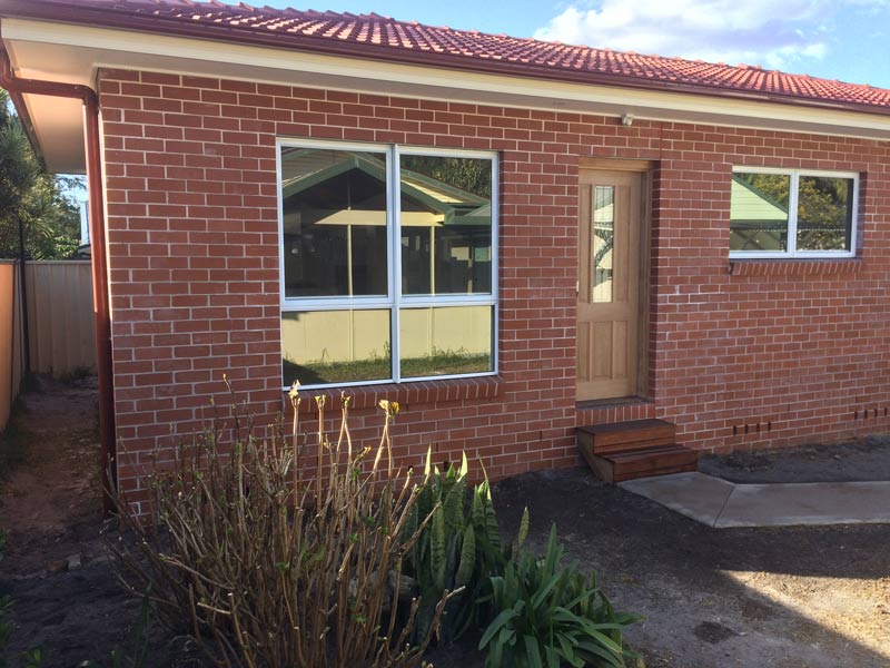 red brick house with windows