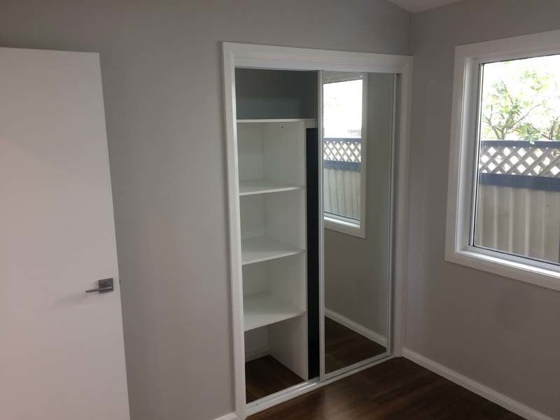 closet with white shelves