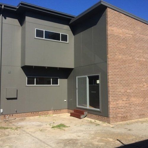 new home with brick and plaster