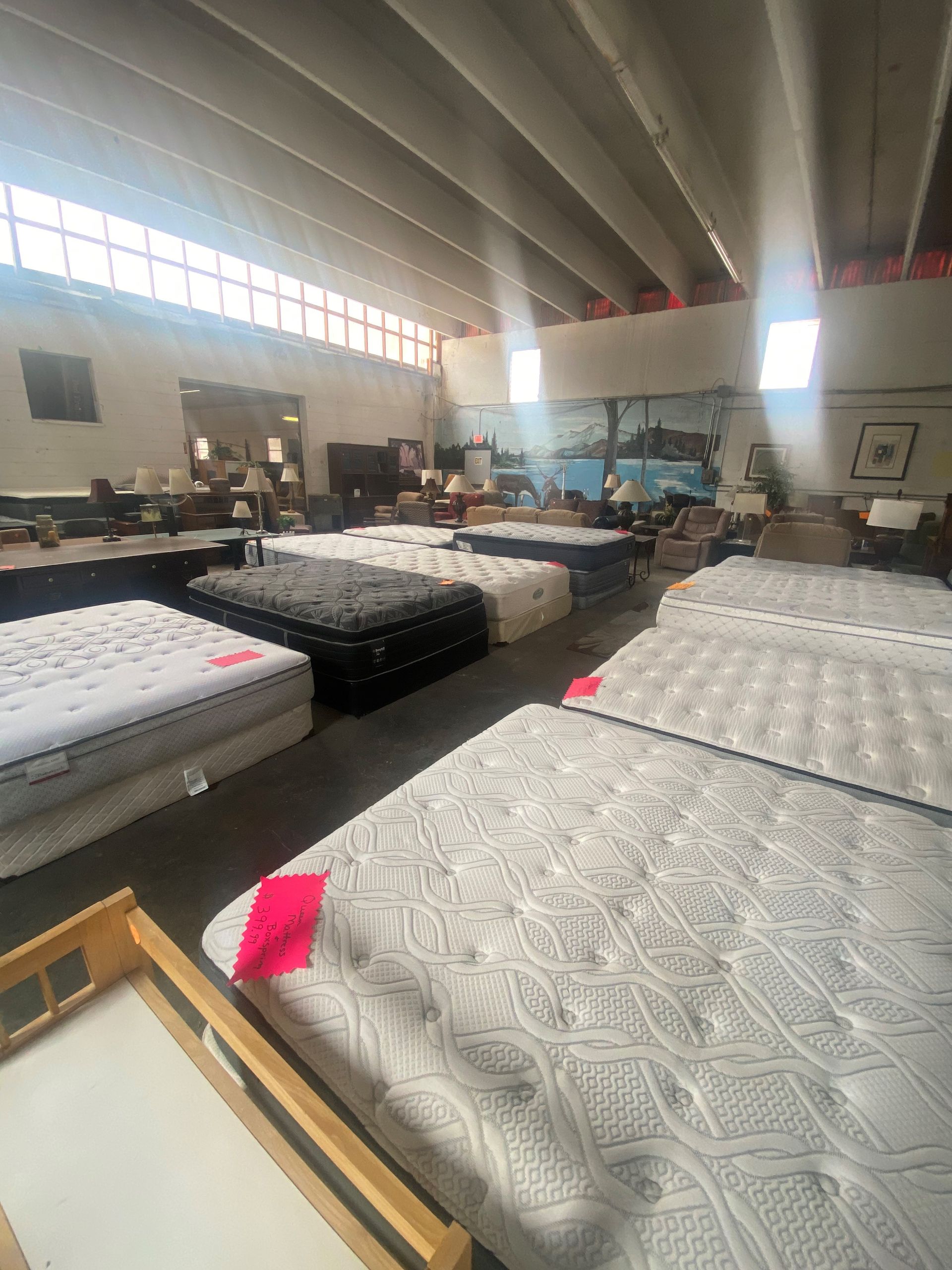 A Large Room Filled With Lots of Mattresses and Furniture — Lakeland, FL — Thomason Furniture & Mattress