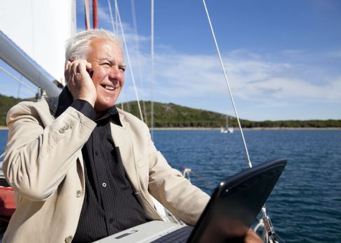 businessman on boat making a call