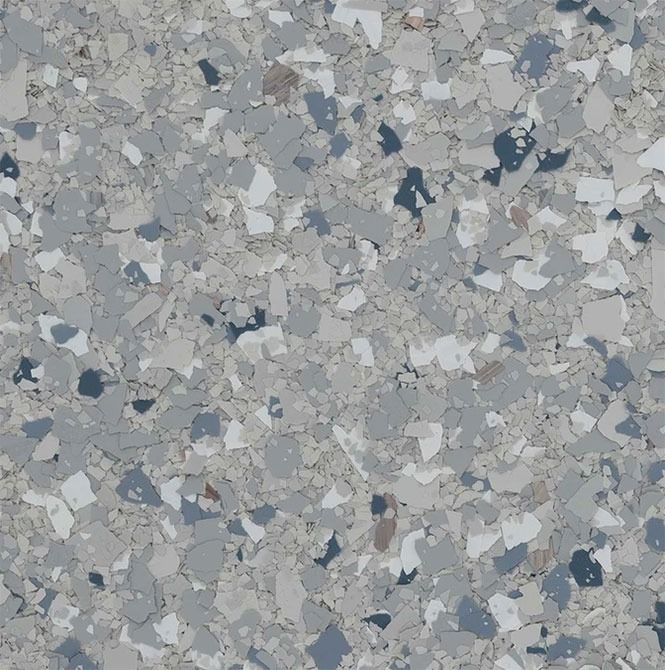 Gray, blue, and white speckled floor with a textured, chip-like appearance.