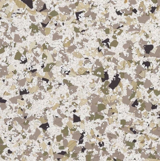 Floor with a speckled pattern, featuring white, beige, green, brown, and black chips.