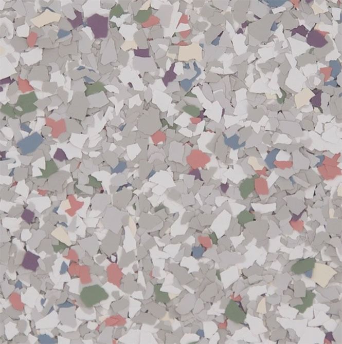 Gray and white speckled flooring with flecks of various colors.