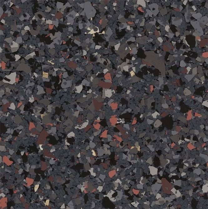 Close-up of speckled, multi-colored floor with various gray, black, and reddish fragments.