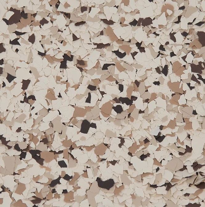 Tan, brown, and black speckled epoxy floor covering.