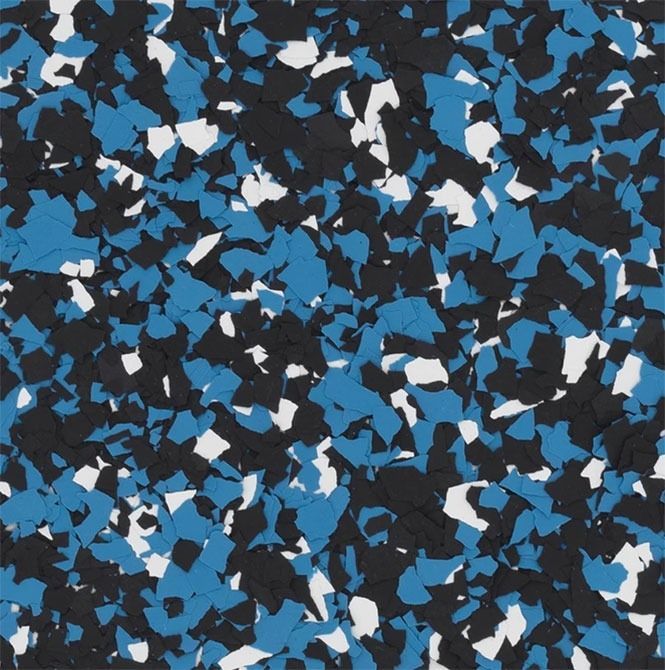 Textured floor with blue, black, and white chips scattered across a dark background.