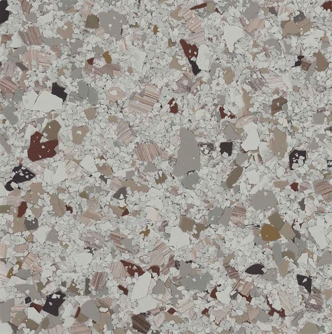 Speckled flooring pattern in shades of gray, beige, and brown.