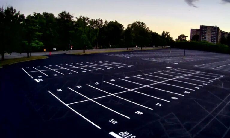 An empty parking lot with white lines on it
