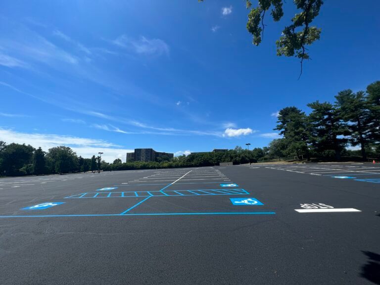 A parking lot with a handicap sign painted on it