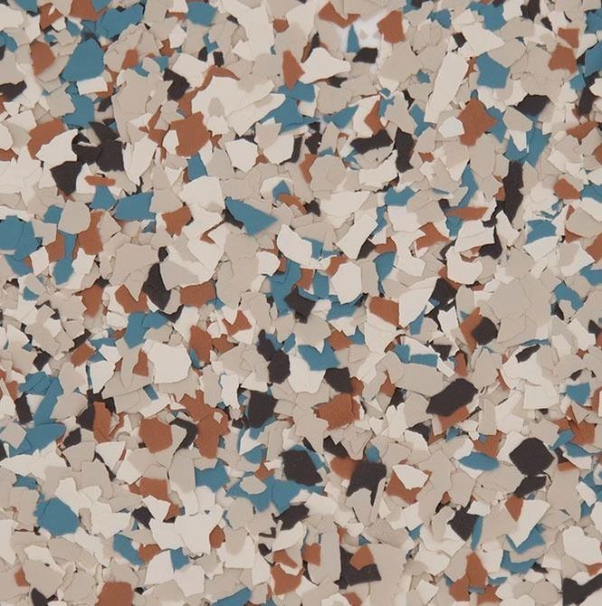 Multicolor epoxy floor with blue, brown, beige, and black chips.