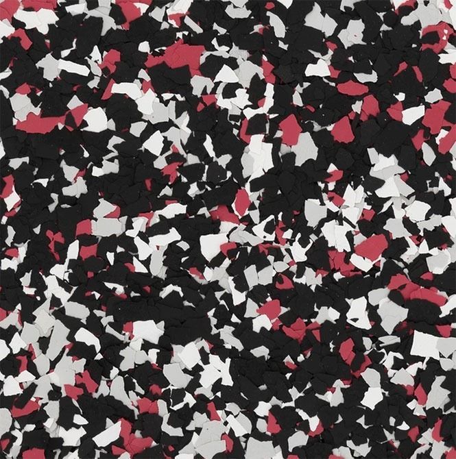 A close-up of a speckled floor with black, white, and red chips.