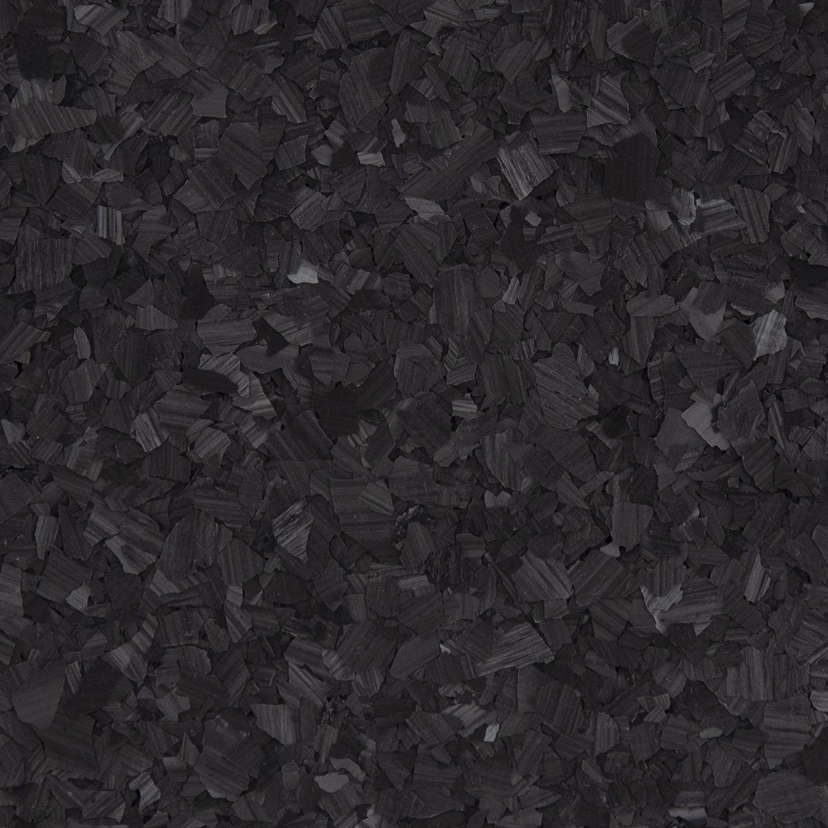 Dark charcoal textured pattern with small abstract fragments.
