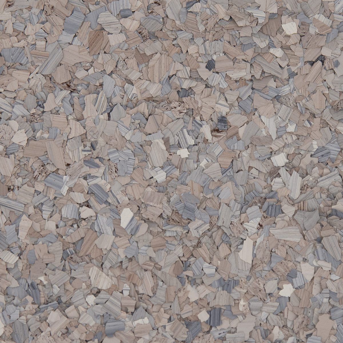 Close-up of a beige and gray speckled stone or gravel surface