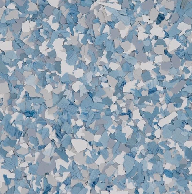 Blue, white, and gray decorative floor flakes create a textured pattern.