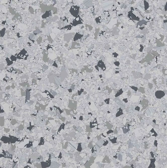Speckled flooring with light gray, dark gray, and white chips.