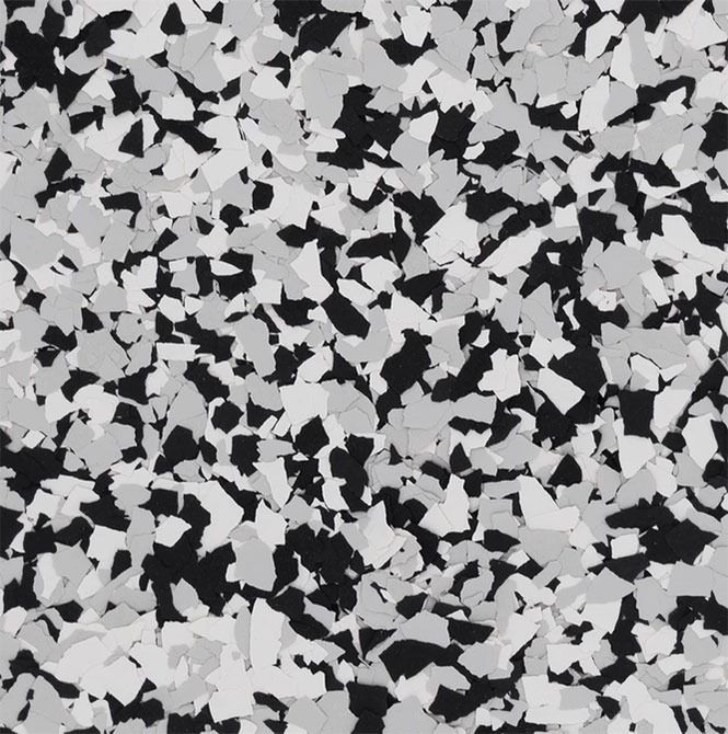 Black, white, and gray speckled floor covering.