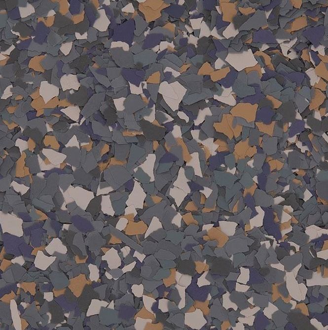 Floor with a speckled pattern of gray, blue, tan, and cream flakes.