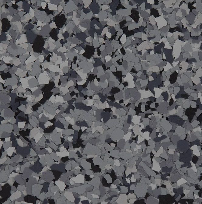 A close up of a gray and black marble floor