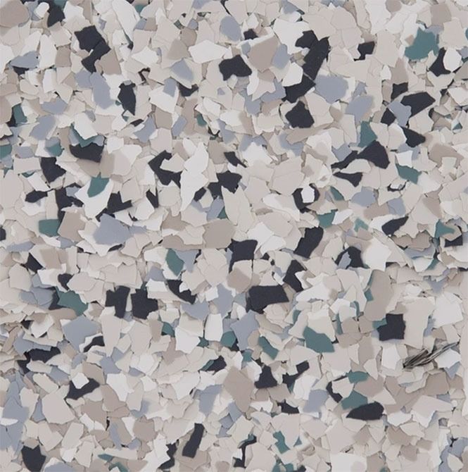 Speckled floor coating in neutral tones of beige, gray, white, and dark blue.