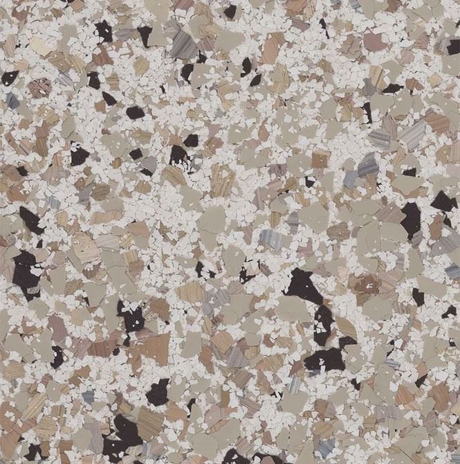 Speckled floor covering in shades of brown, beige, black and white.
