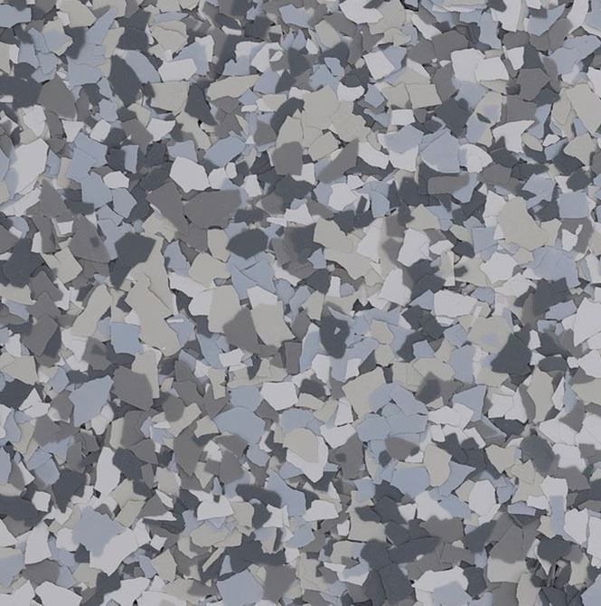 A close up of a gray , white , and black marble floor.