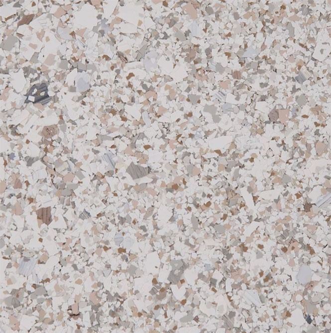 Close-up of speckled flooring with shades of white, beige, and gray.
