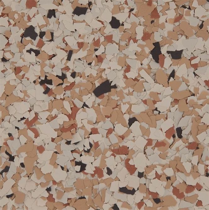 Multi-colored speckled flooring pattern with tan, cream, red, and dark brown chips.