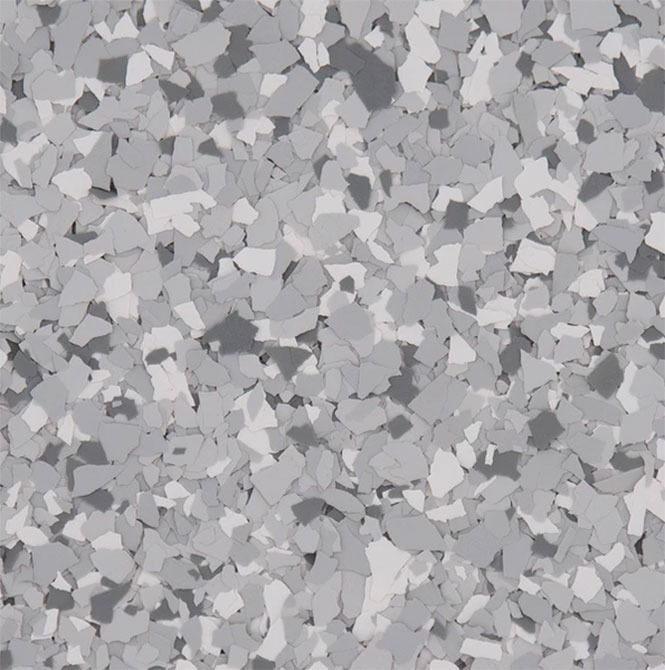 Close-up of a floor with a speckled pattern in shades of gray, white, and charcoal.