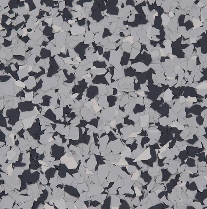 Floor with a speckled pattern in gray, white, and dark gray.
