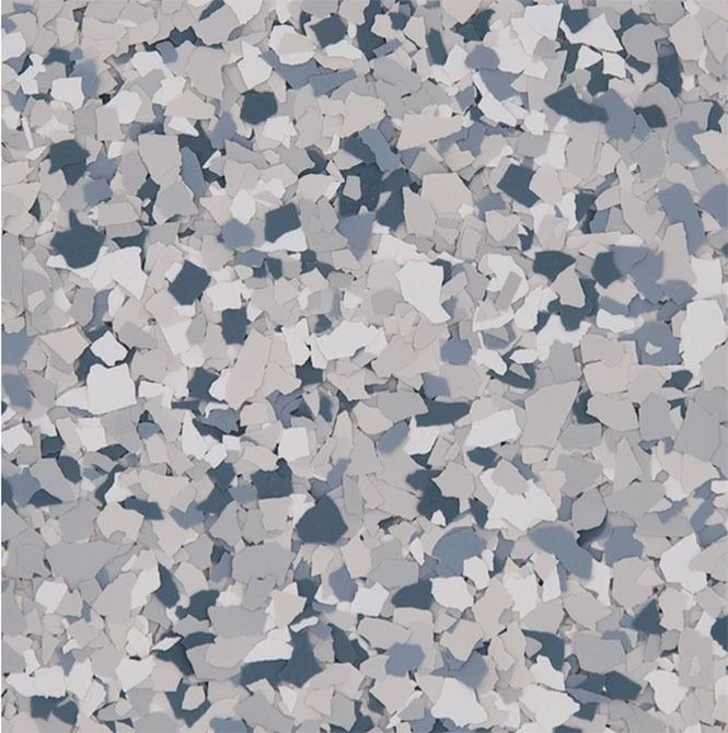 Close-up of a speckled flooring design in shades of gray, blue, and white, resembling stone or chips.
