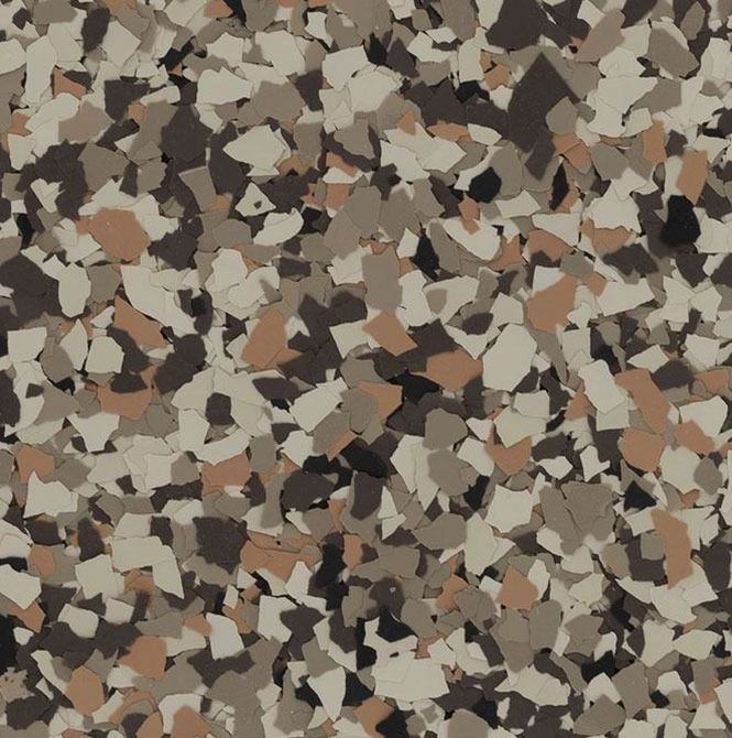 Multi-colored speckled floor coating with tan, brown, and beige chips.