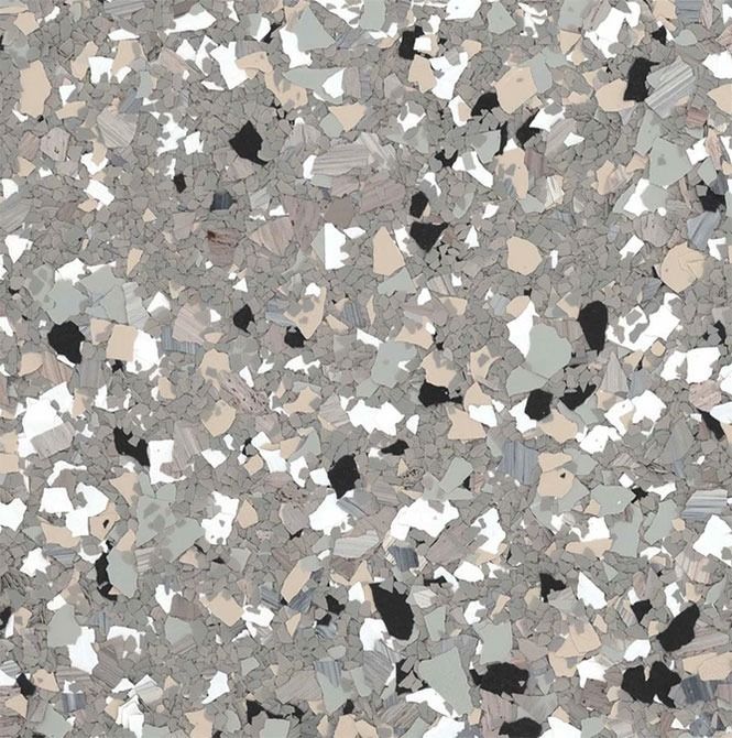 Terrazzo-style flooring pattern with grey, white, beige, and black chips scattered across the surface.