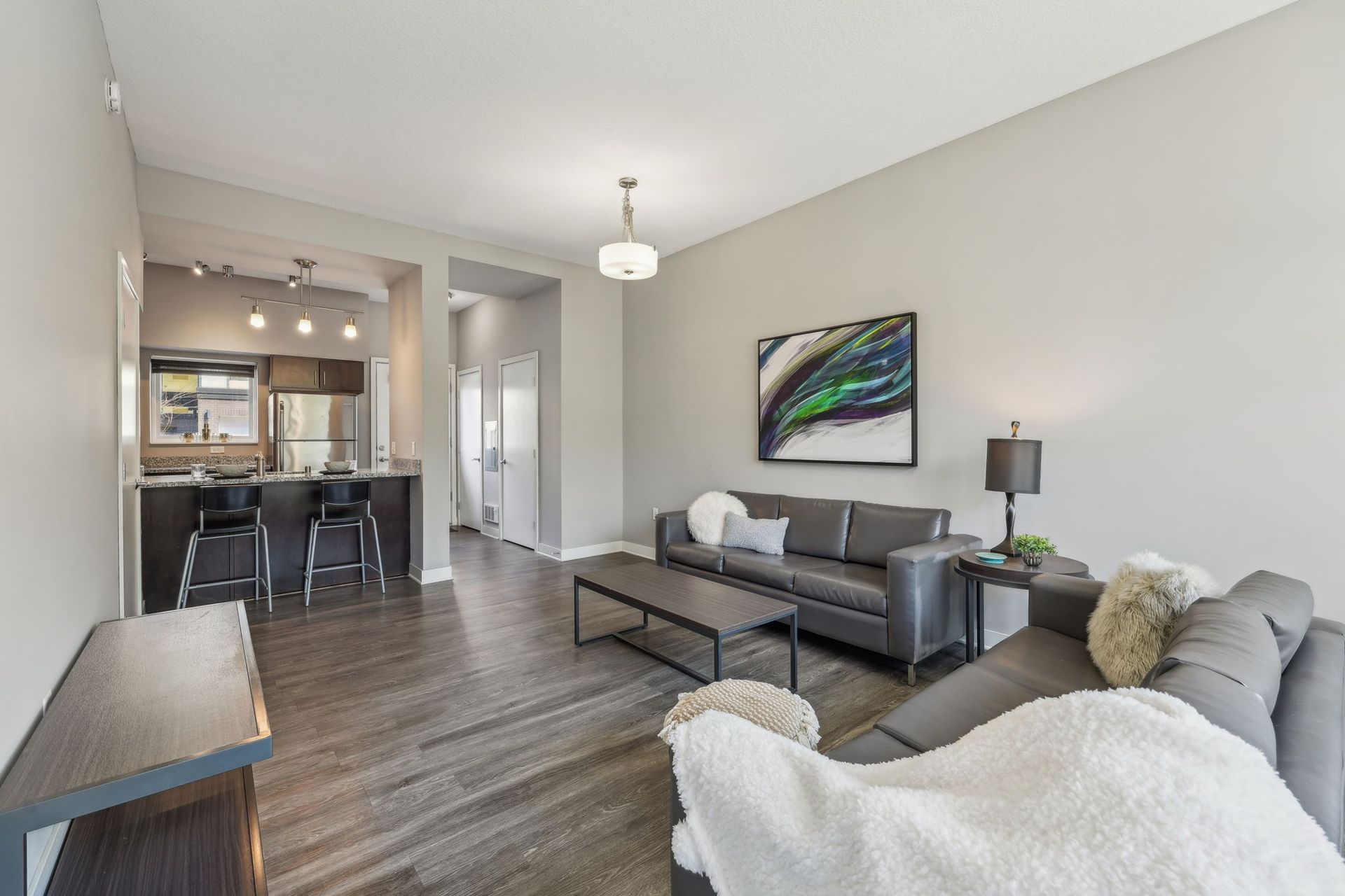 Living room with open concept kitchen at Minneapolis apartment