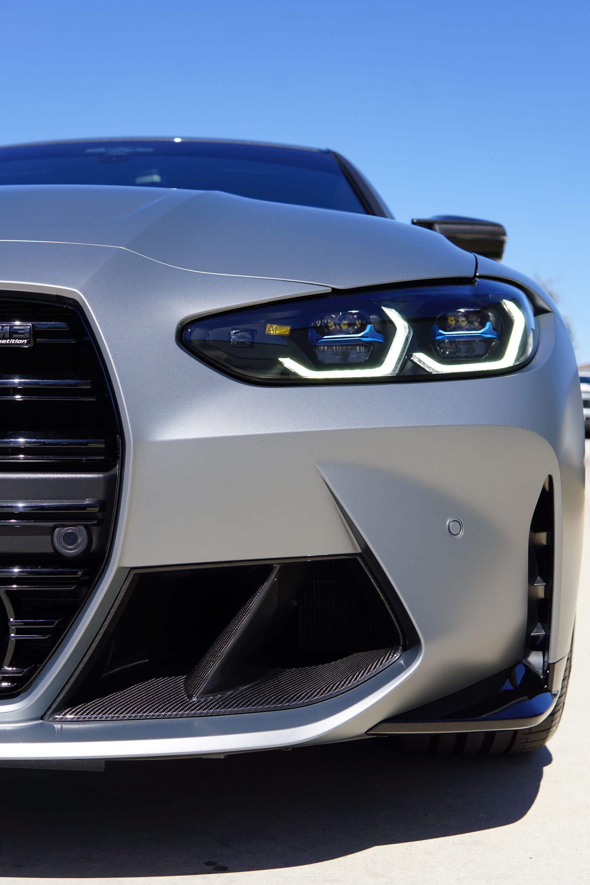 A close up of the front of a bmw m4