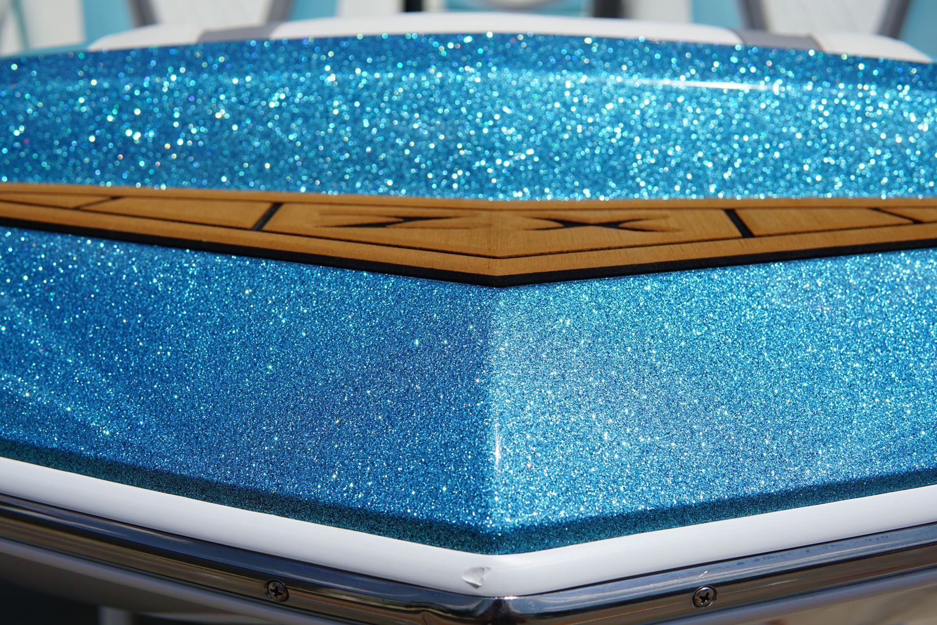 A close up of a blue and white boat with glitter on it