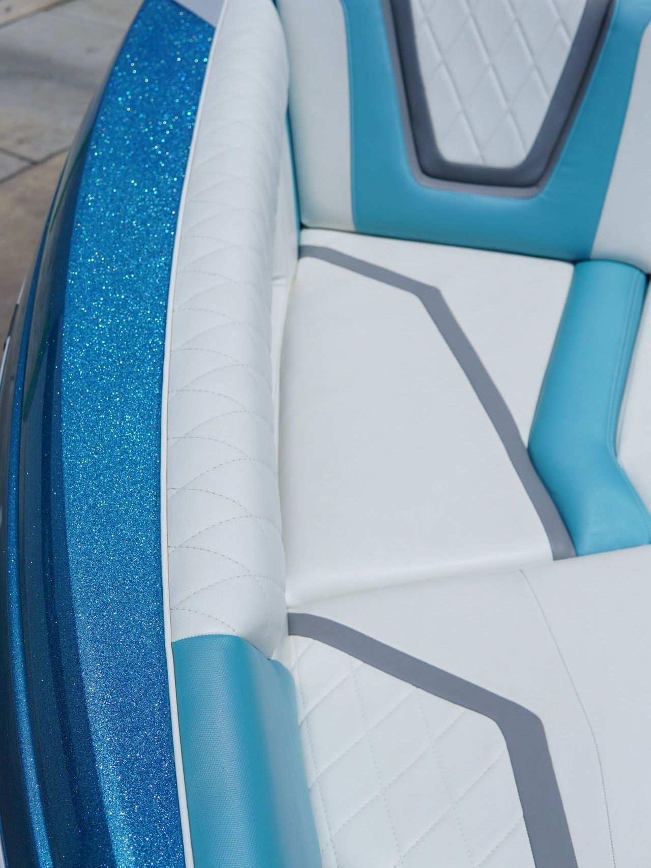 A close up of a blue and white boat seat