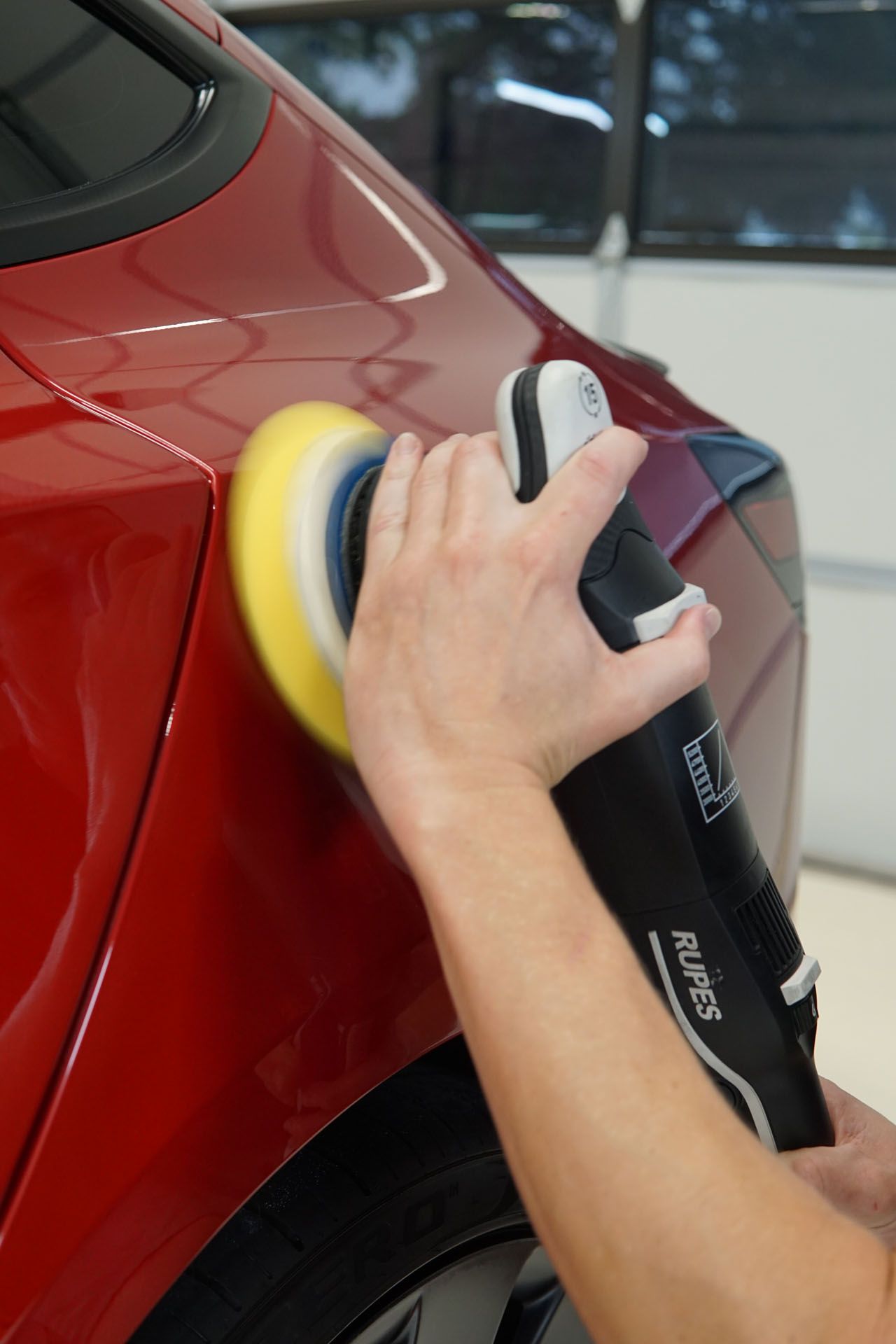 Tesla paint correction showing deep gloss restoration
