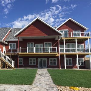 A large red house with many windows and balconies