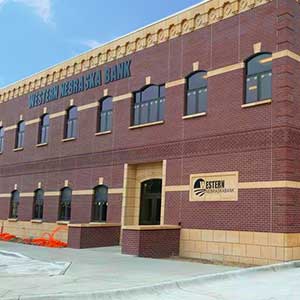 A large brick building with a sign that says western nebraska bank