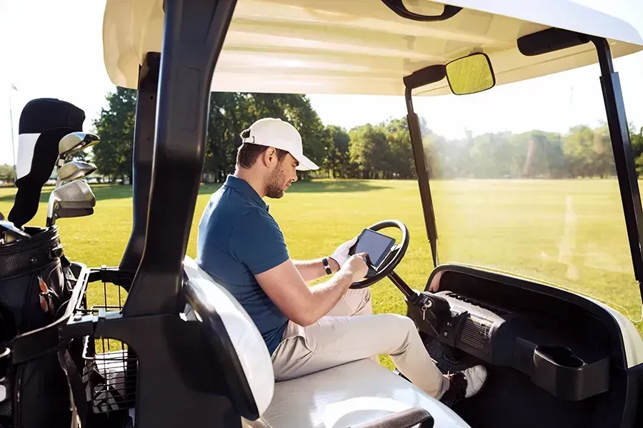 Golfer on a golf cart
