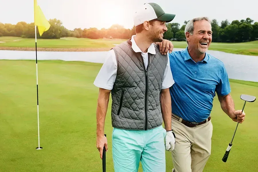 Men golfing together